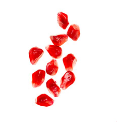 pomegranate seeds on white background
