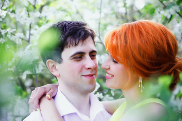 couple   walking in   spring garden.