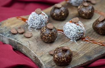 Healthy raw energy balls with cocoa, coconut, nuts