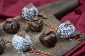 Healthy raw energy balls with cocoa, coconut, nuts