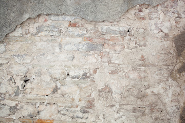 old medieval plaster and brick wall in shadow