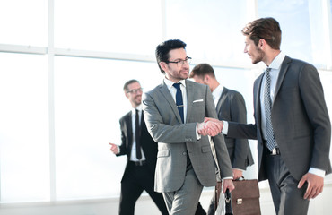 Business people shaking hands, finishing up a meeting