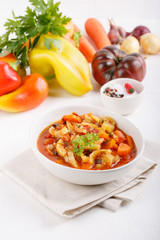 Stewed vegetables. Vegetable ragout of sweet pepper, carrot, onion, tomatoes. Vegetarian food.