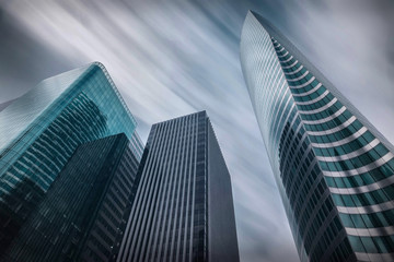 Fototapeta premium New modern business buildings under sky with clouds in Paris. 