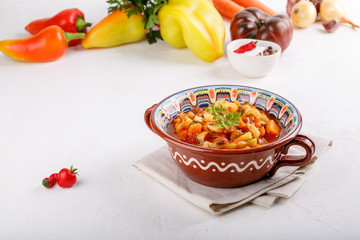 Stewed vegetables. Vegetable ragout of sweet pepper, carrot, onion, tomatoes. Vegetarian food.