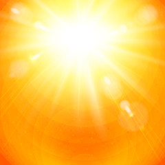 Dramatic golden sunburst in a fiery orange sky.