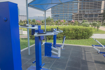 Fototapeta na wymiar Public sport and exercise equipment. Clean air and green spaces