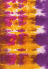 Hand painted abstract spotted colorful tie-dye textile background pattern