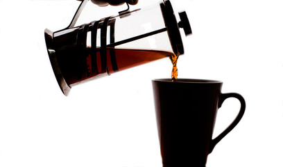 Teapot with black tea and  mug on white background isolate