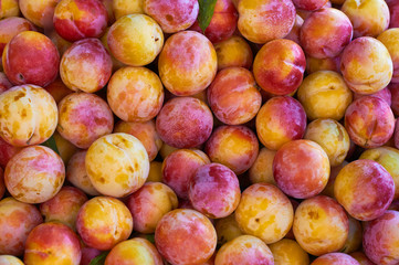 Background of yellow red plums. Street market in Turkey. Coast of the Aegean Sea. Turgutreis , Bodrum. (corrected) 