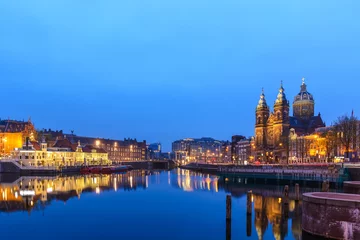 Fotobehang Amsterdam Netherlands, night city skyline at Basilica of Saint Nicholas © Noppasinw