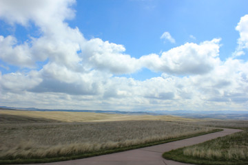 blue sky and clouds over prarie