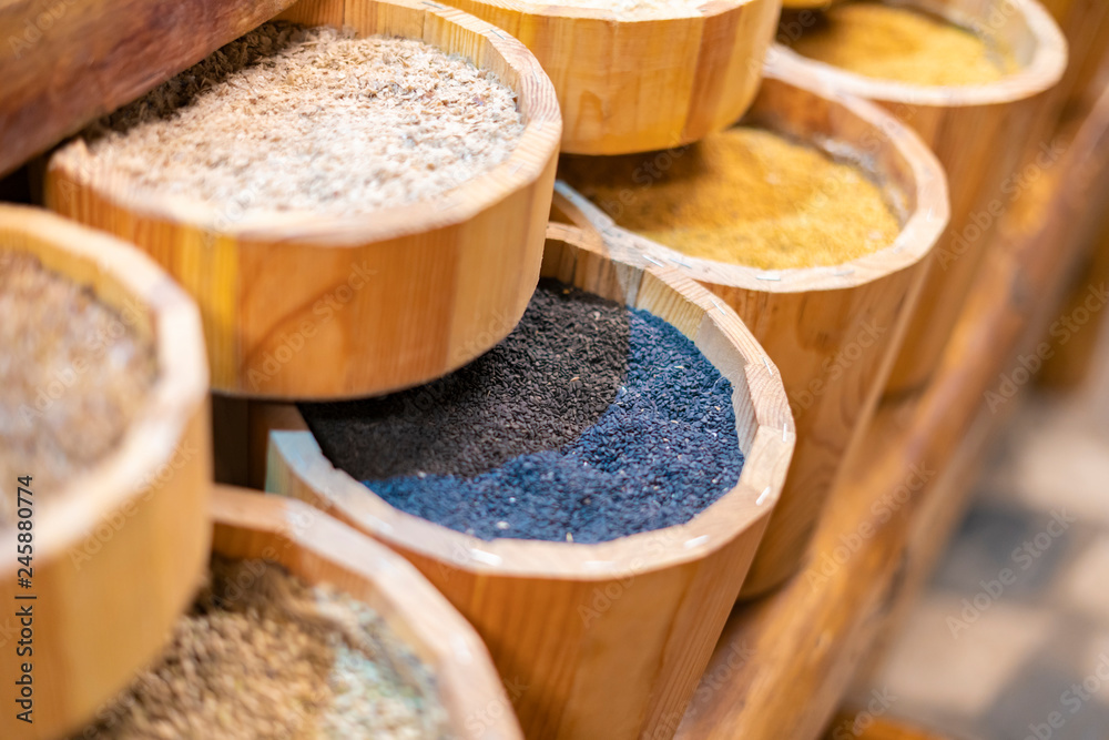 Wall mural counter with rows of different grains in the market store f