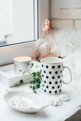 Morning home arrangement with cup of tea