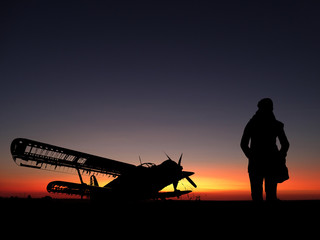 Sunset Horizon with an Airplane and a Traveler