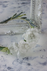 White wedding background with silk hair flowers