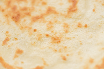 Macro texture of ruddy fresh tasty pancakes