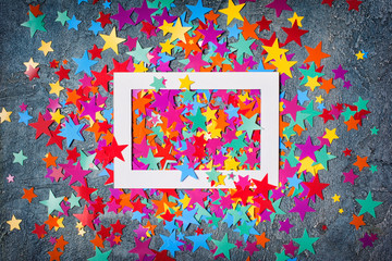 White frame with bright colorful confetti in star shape