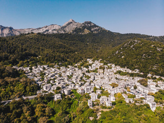 Fototapeta premium Thasos island small town of Panagia in the middle of the island, with houses painted in white and stone roofs, traditional greek way