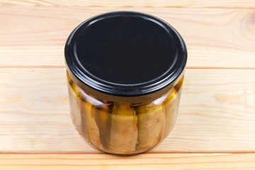 Smoked sprats preserved in vegetable oil in glass jar