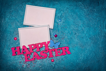 Mock up of blank white frame with pink text of happy easter and colorful dragee with sugar sprinkles