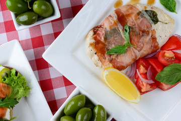 Tasty meat near vegetables on plate