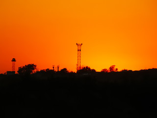 Telephone tower on the background of a beautiful sunset, suitable for news articles or magazines, as well as for blogs