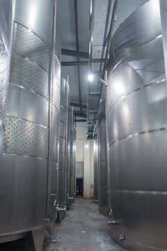 Winemaking metal barrels in a modern winery