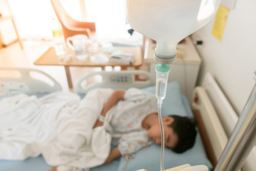 Little boy get sick from influenza need to be admitted to hospital with saline intravenous (iv)  in-line hand pressure - 245886587