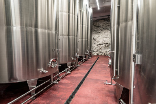 Interior of a modern winery making wine in aluminium tanks