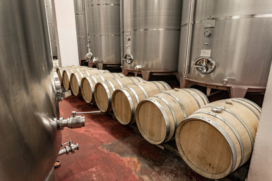 Modern winery making wine in oak barrels and aluminium tanks