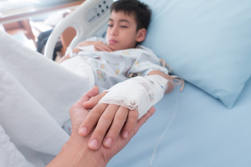 Little boy get sick from influenza need to be admitted to hospital with saline intravenous (iv) ...