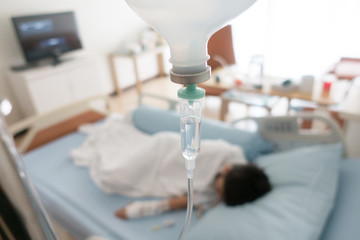 Little boy get sick from influenza need to be admitted to hospital with saline intravenous (iv) ...