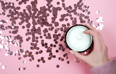 Moisturizer on a shiny background. Winter care.