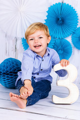 Little boy celebrating third birthday