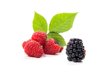 Ripe raspberries with leaf and blackberry isolated on white background.