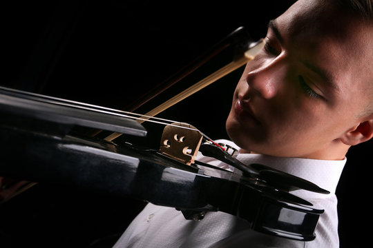 Young men playing the violin