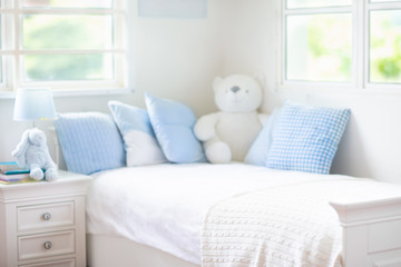 Kids bed in white sunny bedroom