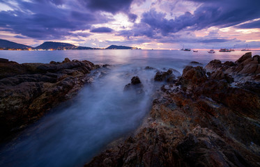 Obraz premium Long exposure image of Dramatic sky seascape with rock in sunset scenery, Beautiful Landscape and light of nature in evening with beautiful colors Clouds and sky