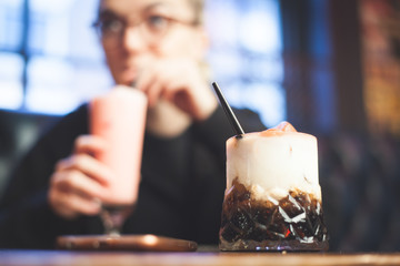 woman drinking cocktail