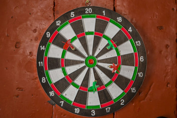 darts hanging on the wall with 