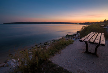empty bench on the beach by the sea for relaxation