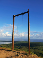 Fototapeta na wymiar amazing huge swing on top of Redonda mountain with panoramic view in Dominican republic
