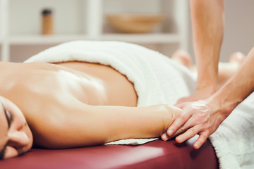 Obraz na płótnie Canvas Young woman is having massage on spa treatment. 