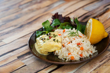 Andalusian fish, saffron rice with vegetables