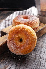 Donuts on black wooden table. Copy space