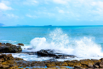 waves crashing on rocks