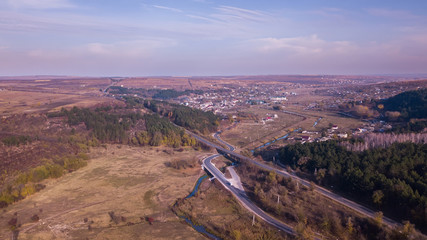 Aerial view of highway crossing villages.