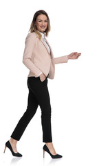 side view of businesswoman walking with hand in pocket