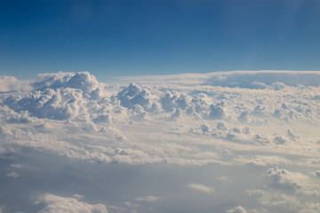 Skyline view above the clouds from airplane.